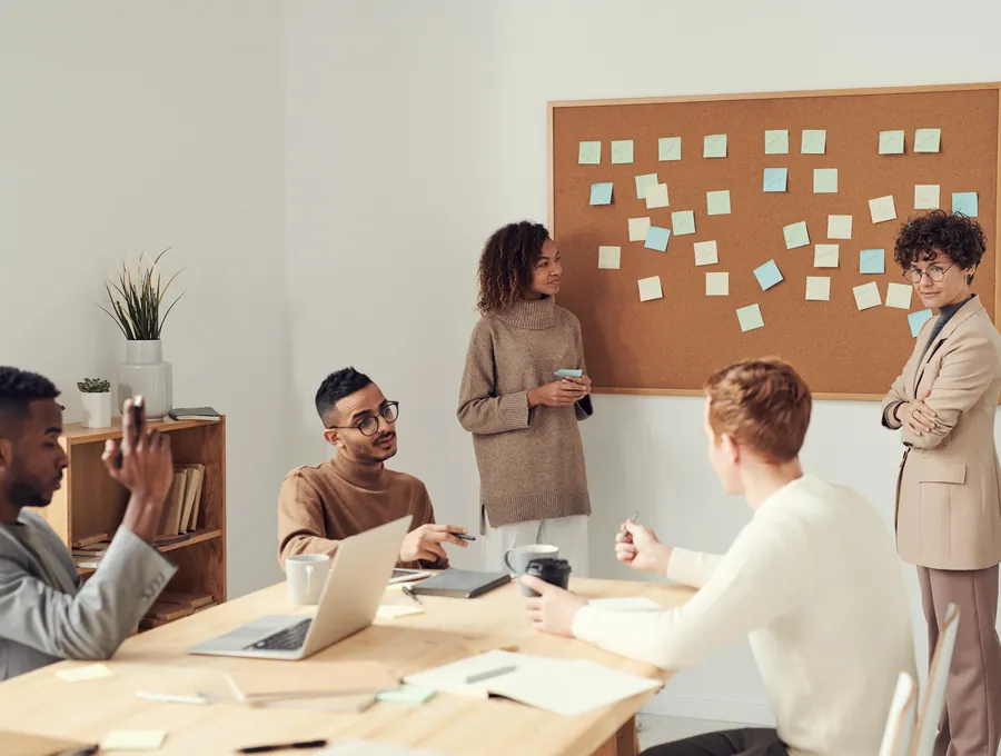 A team coordinating work around a table