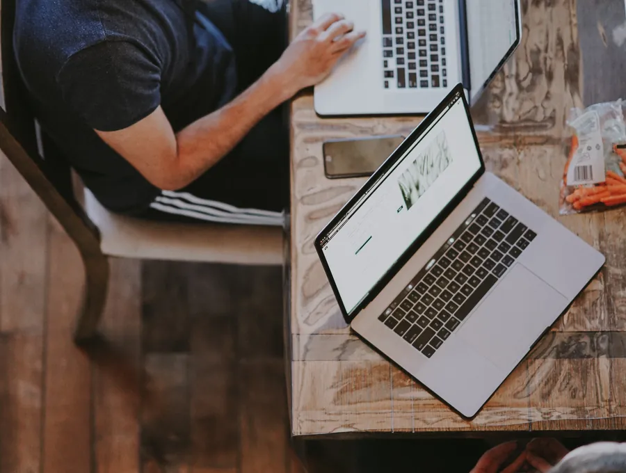 A remote assistant working at a laptop